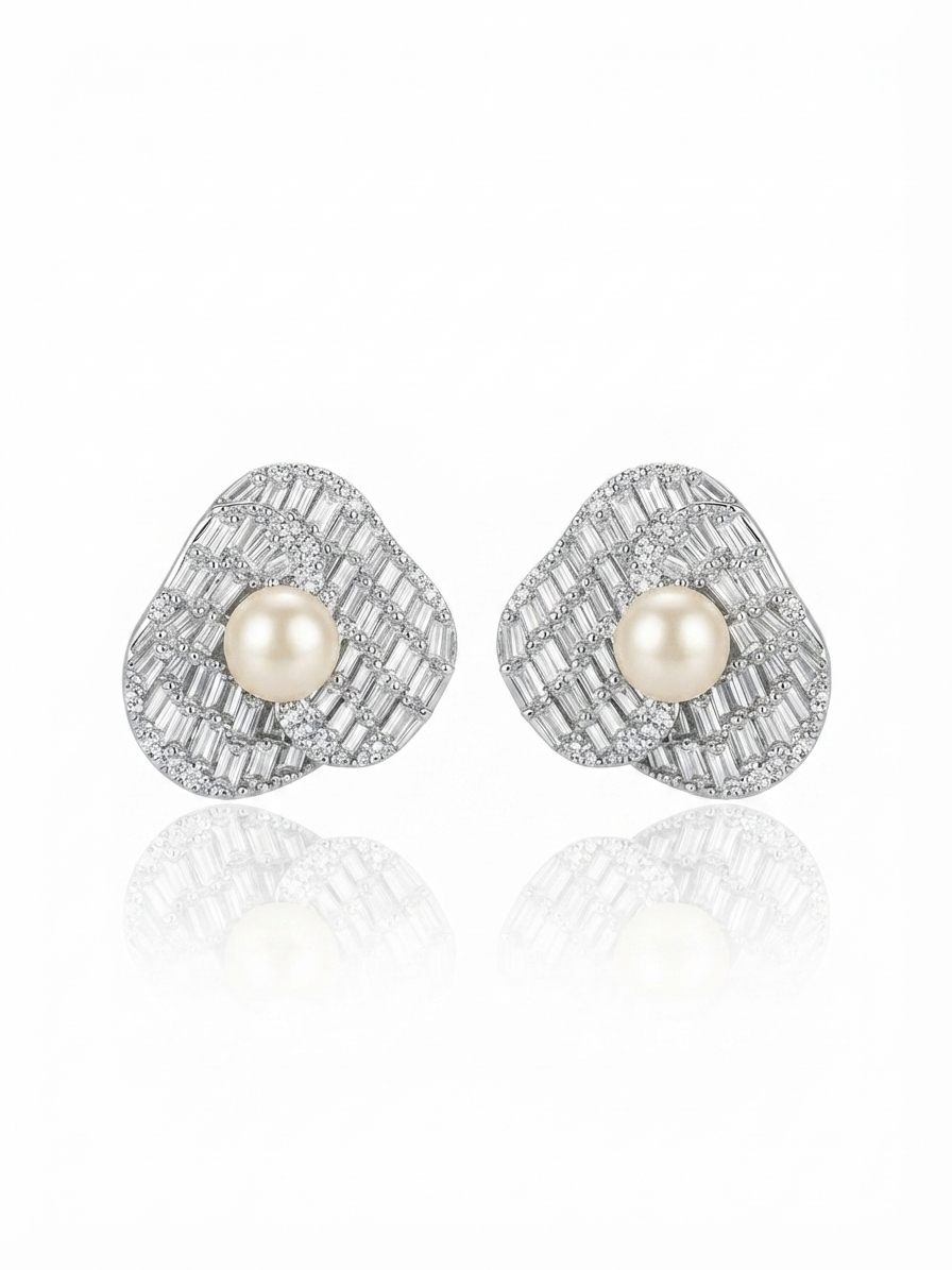 Earrings set with zircon and pearls