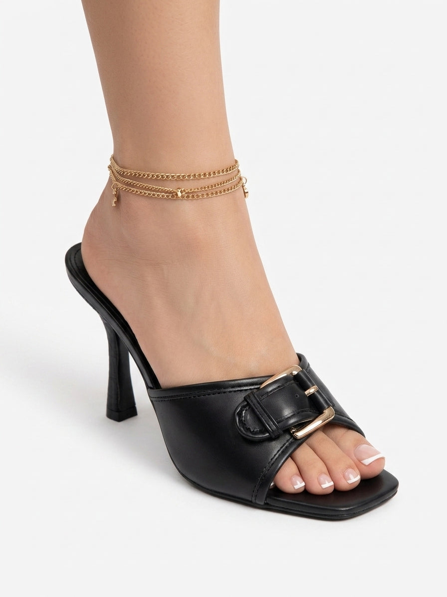 Leather slippers with a front buckle