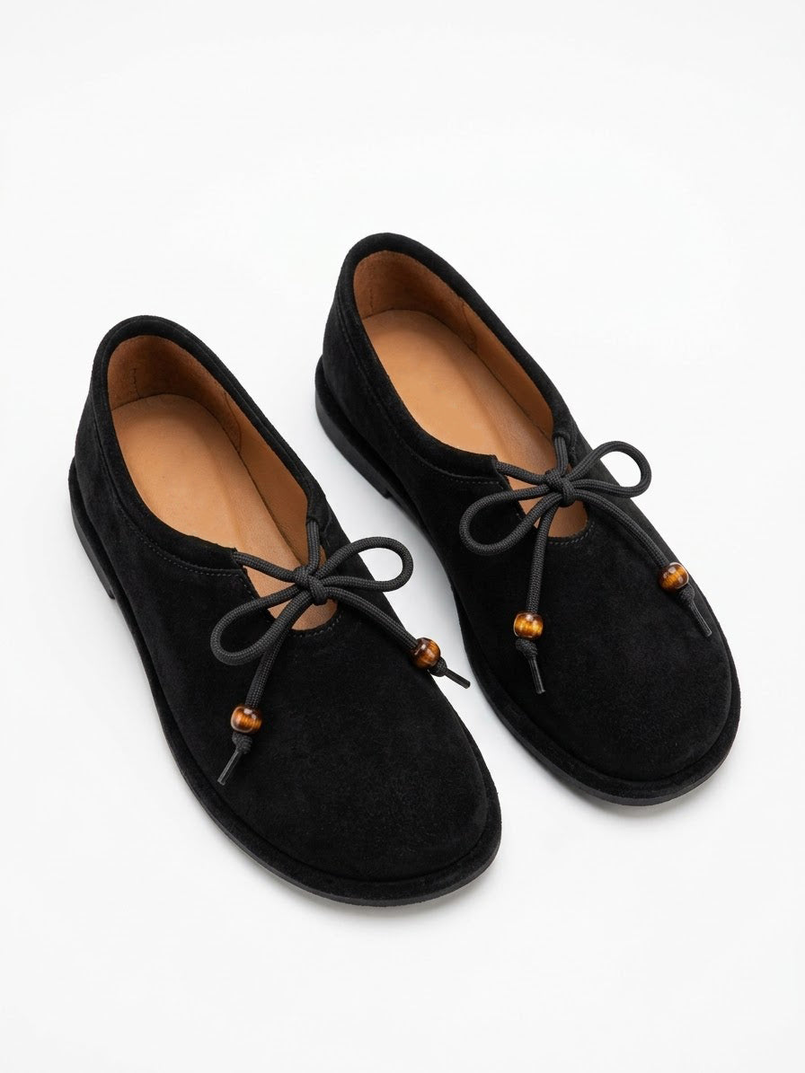 Black suede ballet flats