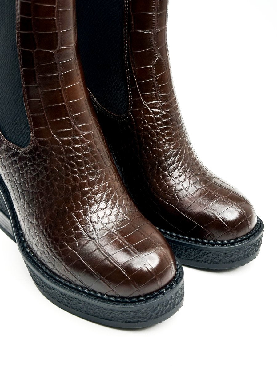 Mid-calf glossy leather boots