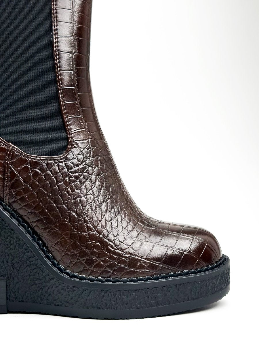 Mid-calf glossy leather boots